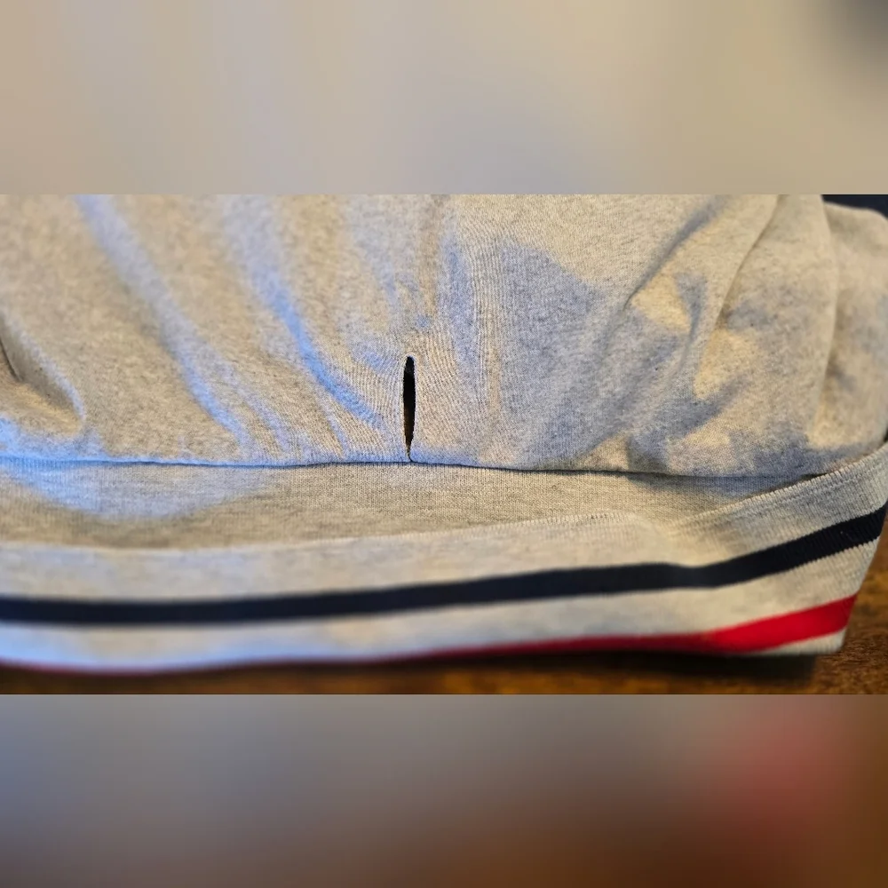 Stylish Gray Dog Polo Shirt with Red and Blue Accents